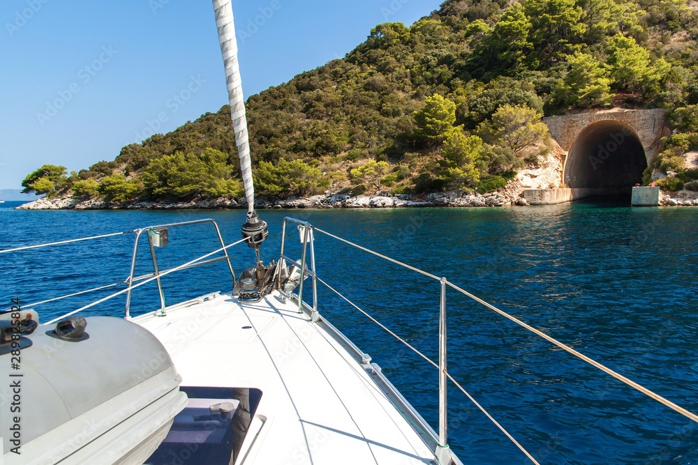 Obraz premium Submarine and ship bunker on Lastovo island, Croatia. Concrete bunker shelter for submarines in adriatic sea. Travel on a yacht in Croatia.