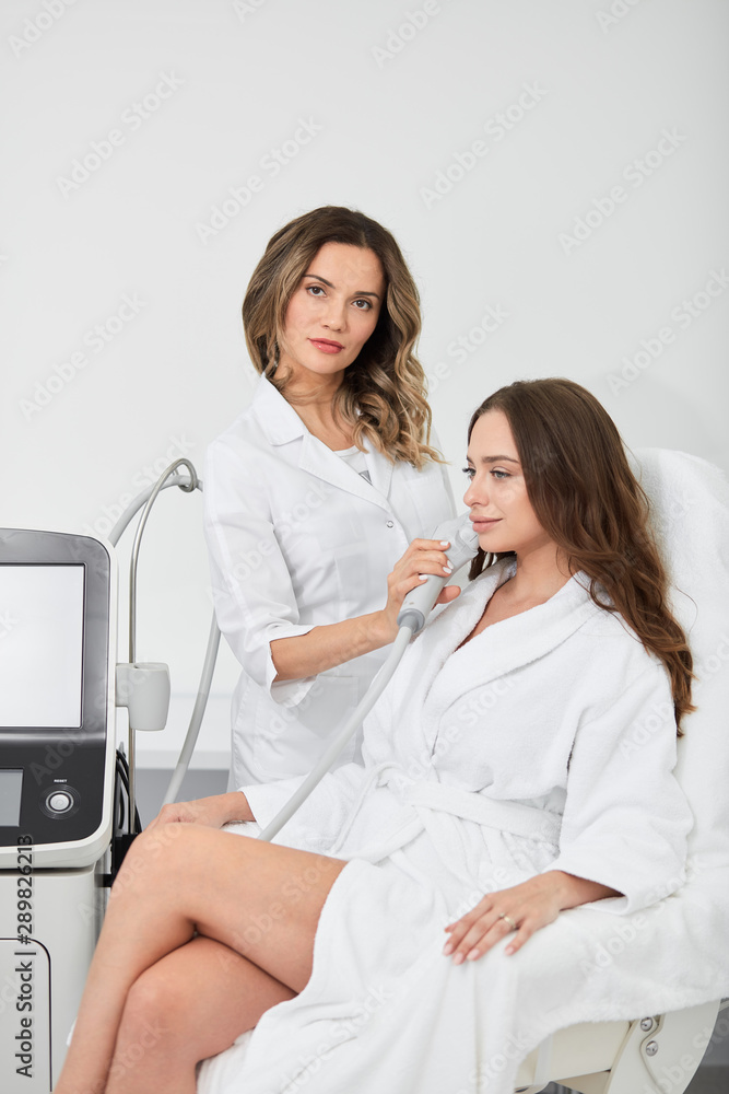 doctor improving the skin of patient in the spa salon, close up portrait,healthy lifestyle,leisure, free time, spare time doctor improving the skin of patient in the spa salon, close up portrait,healthy lifestyle,leisure, free time, spare time