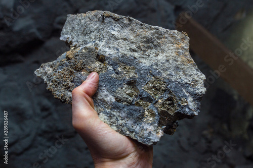 Gold ore pyrite galenite sample specimen in hand