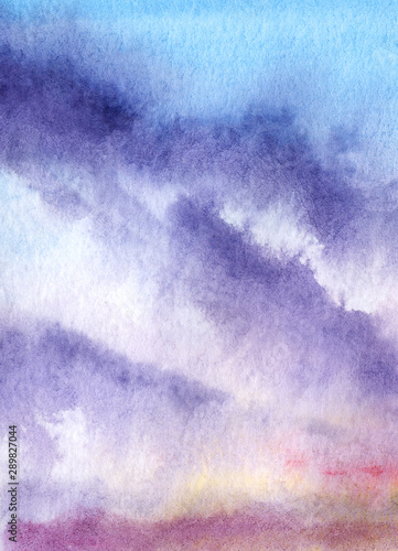 Abstract watercolor background. A smooth gradient from blue to yellow to pink with violet spots. Imitation of the evening sky at sunset with clouds. Hand drawn illustration on texture paper