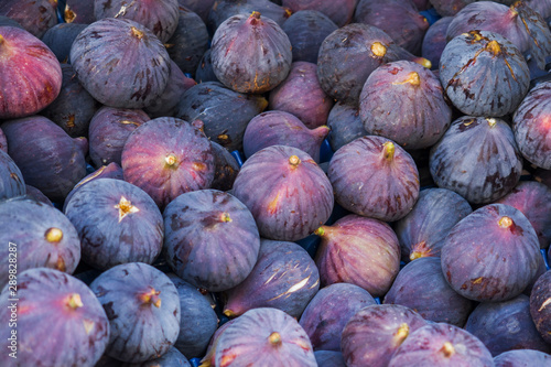 Background of ripe figs on the market. © Elenglush