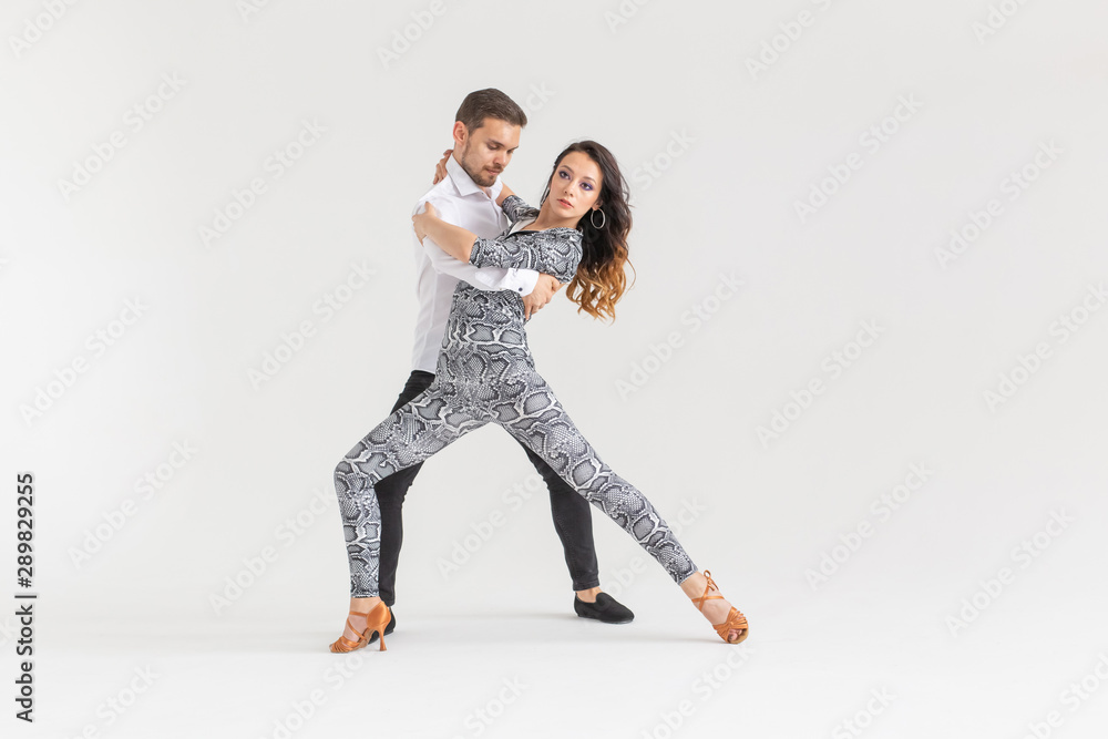 Young love couple dancing social danse kizomba or bachata over white background with copy space Young love couple dancing social danse kizomba or bachata over white background with copy space