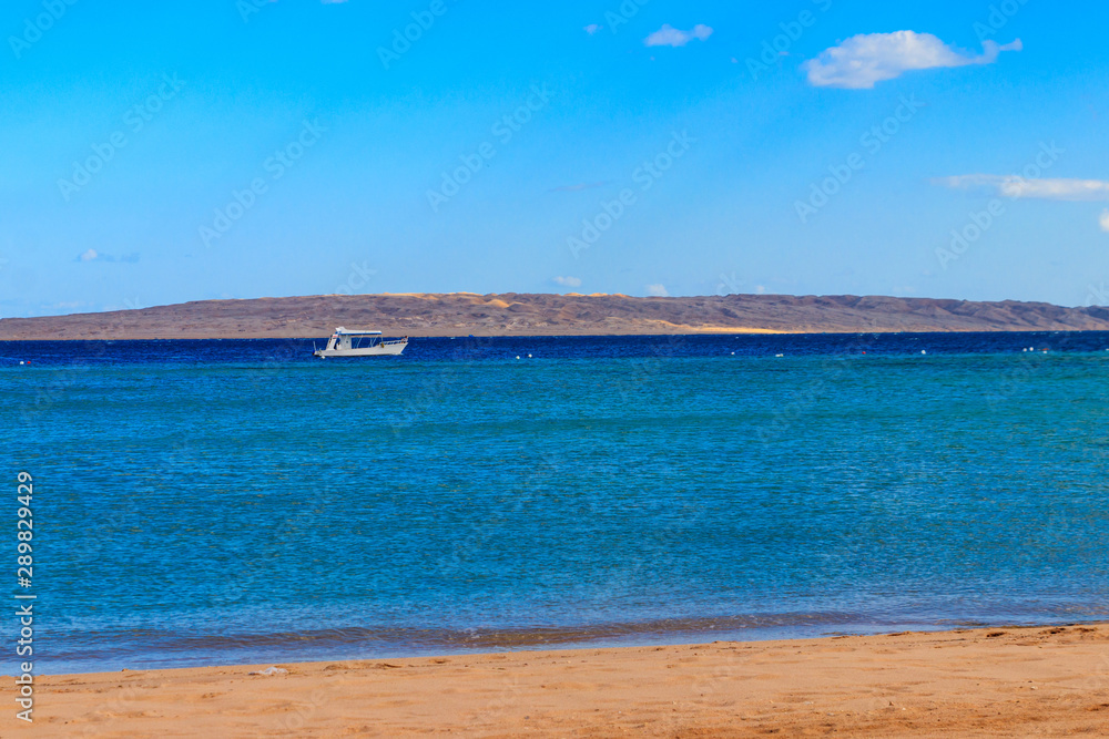 White motorboat sailing in the Red sea, Egypt White motorboat sailing in the Red sea, Egypt