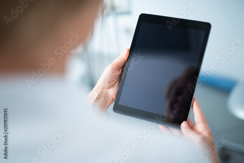 Close up of doctor is holding tablet