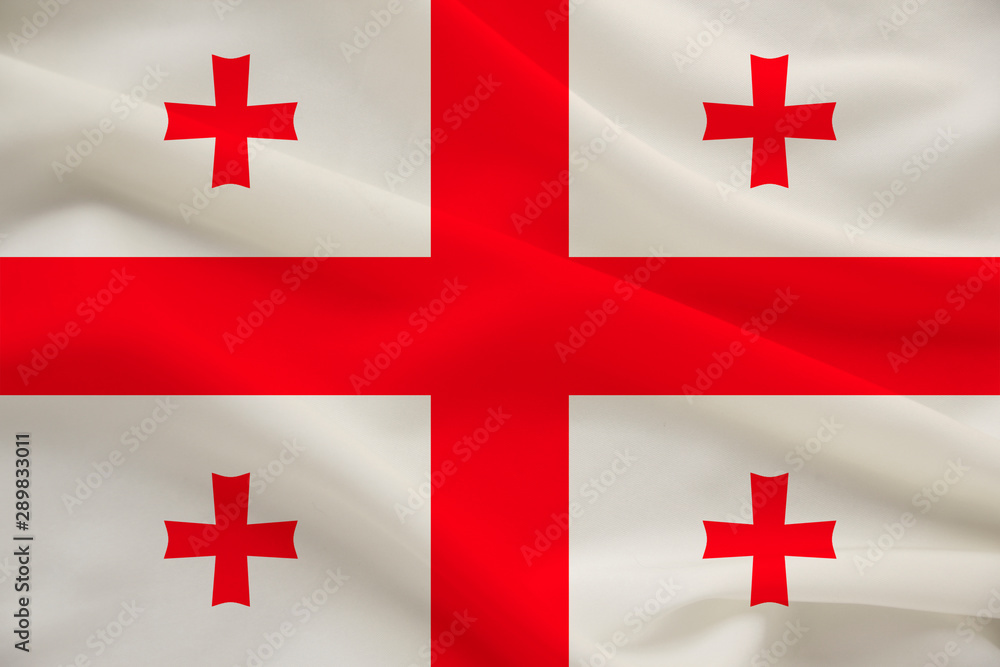 national flag of the country of Georgia on the gentle silk with folds from the wind, the concept of travel, immigration, politics national flag of the country of Georgia on the gentle silk with folds from the wind, the concept of travel, immigration, politics