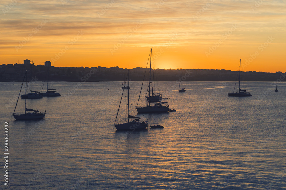 Yacht at sunrise in ocean bay. magical seascape Yacht at sunrise in ocean bay. magical seascape