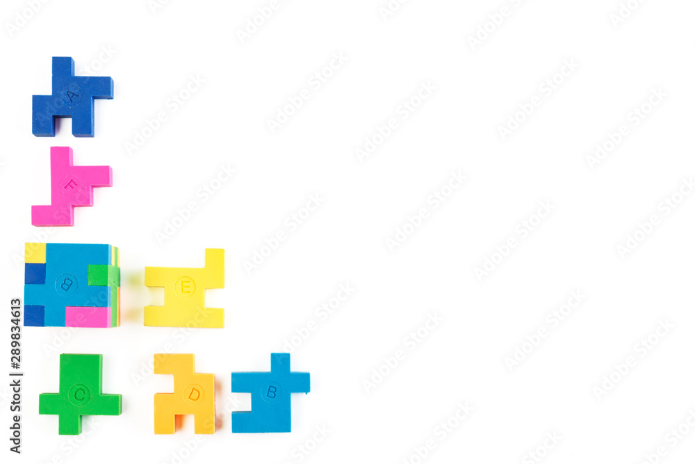 Obraz premium Cube puzzle of multi-colored rubber shapes. Concept of decision making process, creative, logical thinking. Logical tasks.