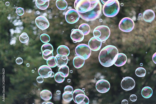 A lot of flying soap bubbles on a city holiday