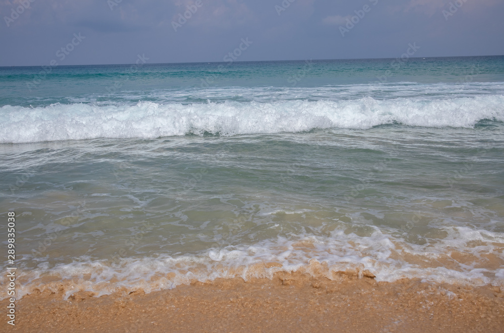Beautiful waves blue sea at Karon Beach Phuket