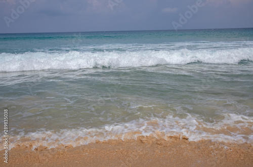 Beautiful waves blue sea at Karon Beach Phuket