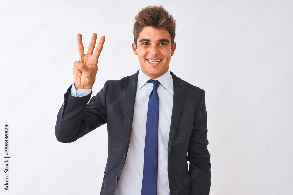 Young handsome businessman wearing suit standing over isolated white background showing and pointing up with fingers number three while smiling confident and happy. Young handsome businessman wearing suit standing over isolated white background showing and pointing up with fingers number three while smiling confident and happy.