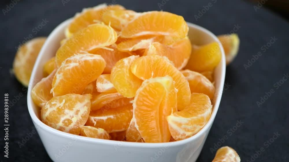 Portion of fresh rotating tangerines as seamless loopable 4K UHD footage Portion of fresh rotating tangerines as seamless loopable 4K UHD footage