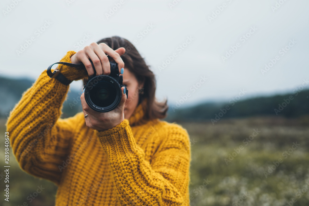photographer girl take photo on camera on background autumn froggy mountain, tourist shooting nature mist landscape, hobby concept, copy space photographer girl take photo on camera on background autumn froggy mountain, tourist shooting nature mist landscape, hobby concept, copy space