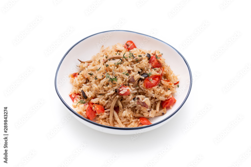 Fried rice with tomato and mushroom on white background Fried rice with tomato and mushroom on white background