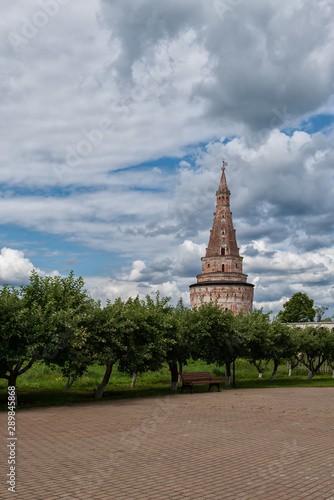 Brick high watchtower and dramatic clouds. Russian shrines. Joseph-Volotsky Monastery in Teryaev. Moscow region, Teryaevo.