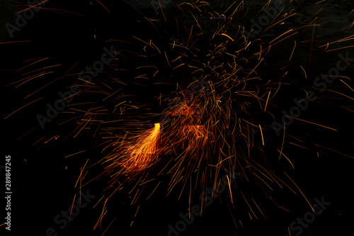 Beautiful sparks in dark backgrounds, Glowing flow of sparks