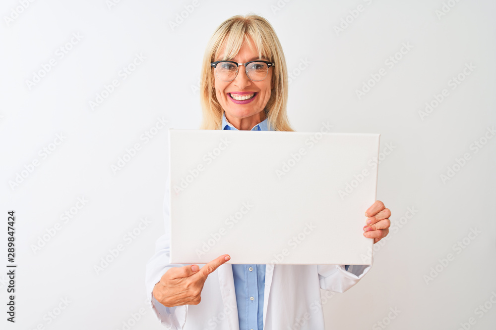 Middle age scientist woman wearing glasses holding banner over isolated white background very happy pointing with hand and finger Middle age scientist woman wearing glasses holding banner over isolated white background very happy pointing with hand and finger