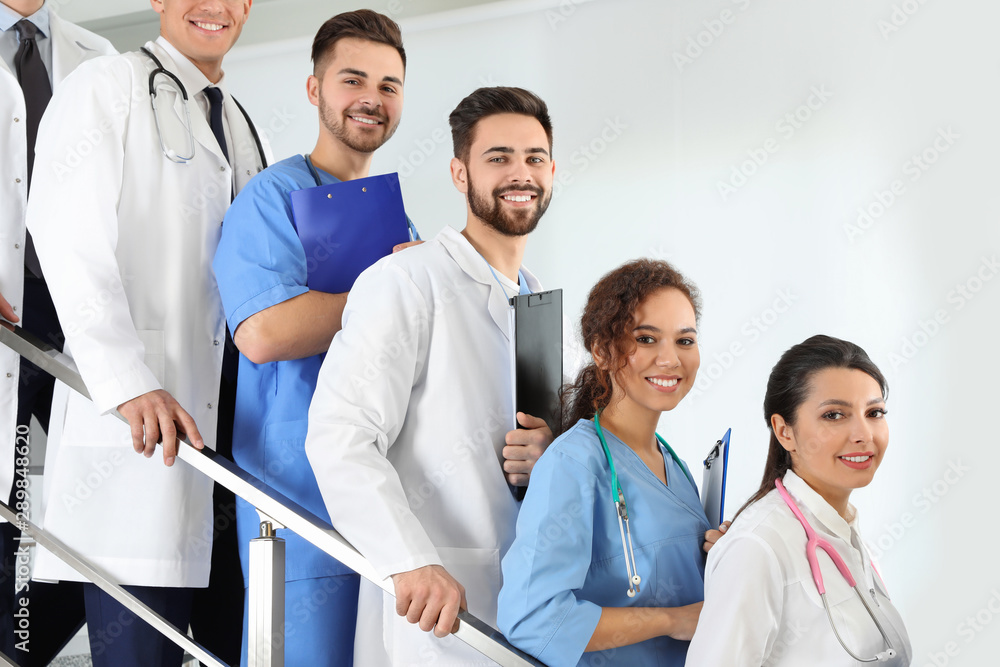 Team of medical workers in hospital. Unity concept Team of medical workers in hospital. Unity concept