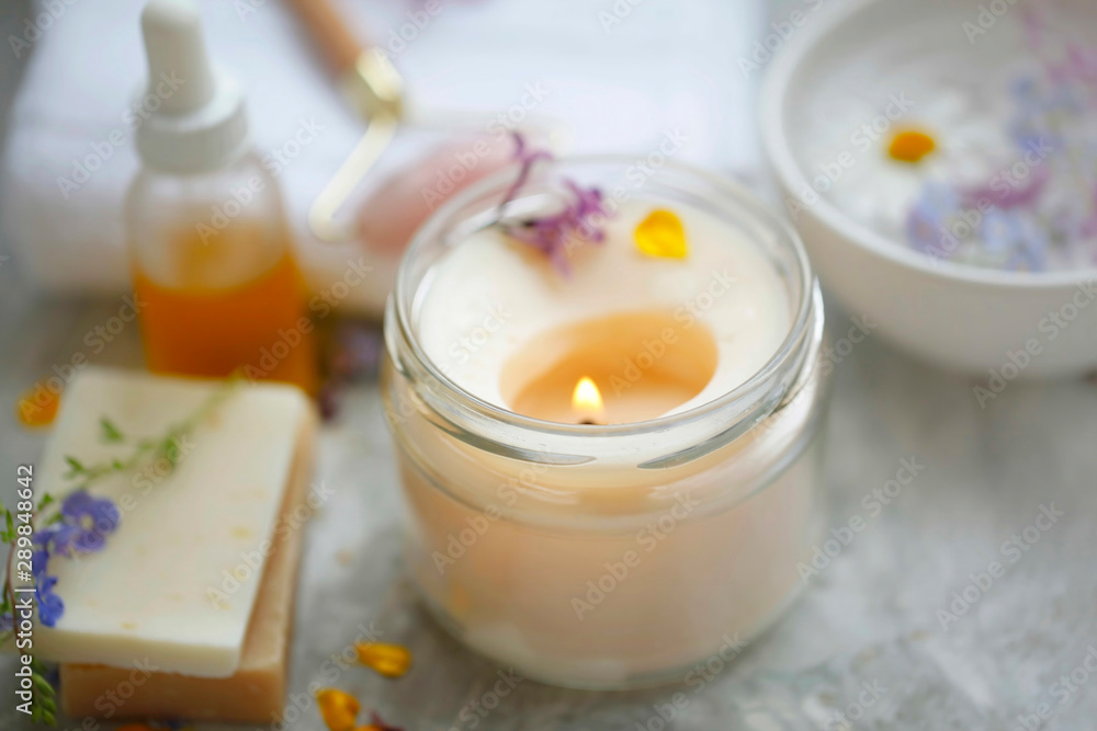 scented spa candle setting composition, selective focus - obrazy, fototapety, plakaty 