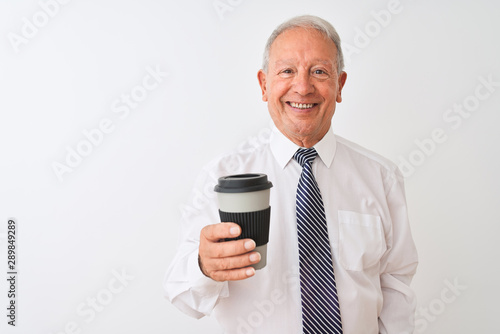 Senior grey-haired businessman drinking take away coffee over isolated white background with a happy face standing and smiling with a confident smile showing teeth © Krakenimages.com