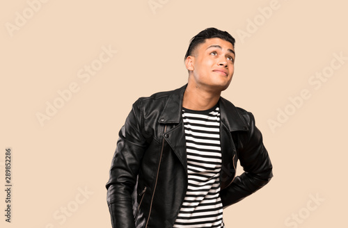 Young man thinking an idea over isolated background