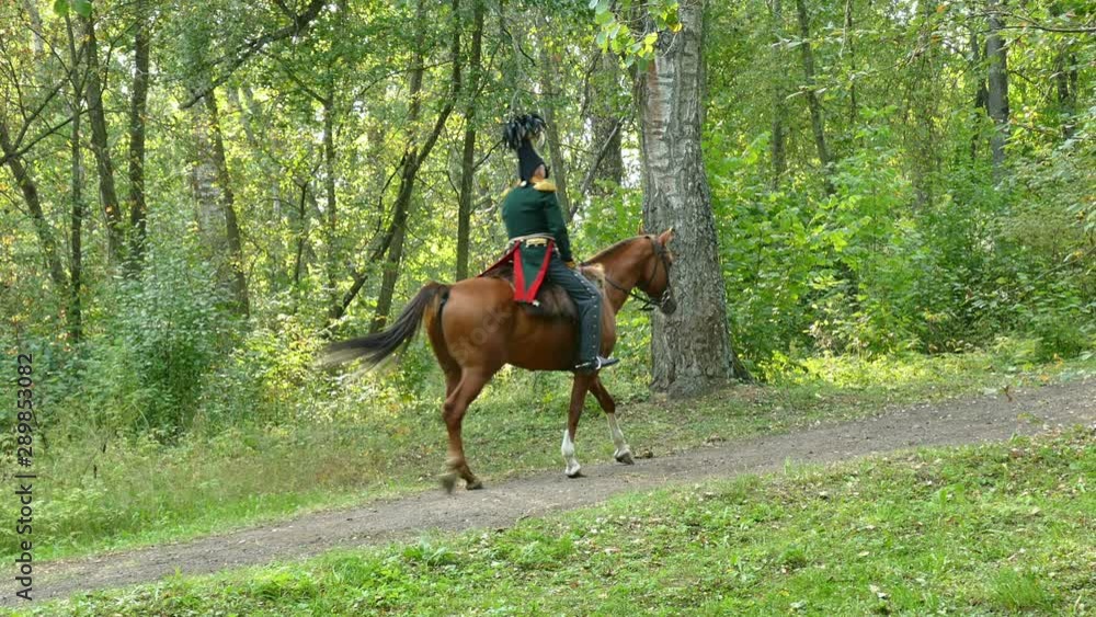 Horsemen. Cavalry squadron moves through the park to its position Horsemen. Cavalry squadron moves through the park to its position