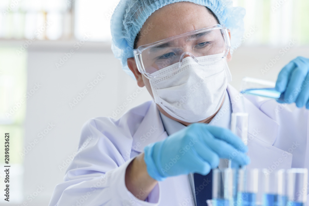 Asian man scientist researching and learning in a laboratory. Asian man scientist researching and learning in a laboratory.