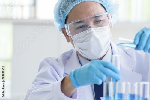 Asian man scientist researching and learning in a laboratory.