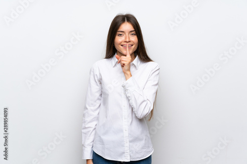 Young woman over isolated white background doing silence gesture