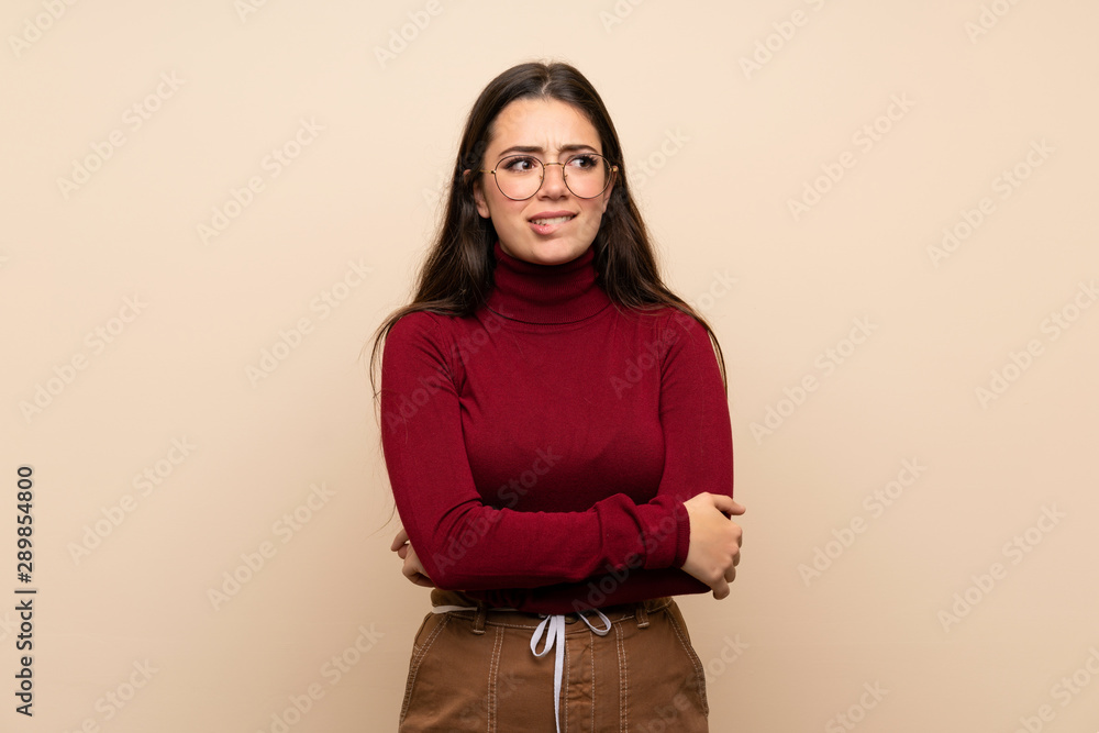 Teenager girl with glasses with confuse face expression Teenager girl with glasses with confuse face expression