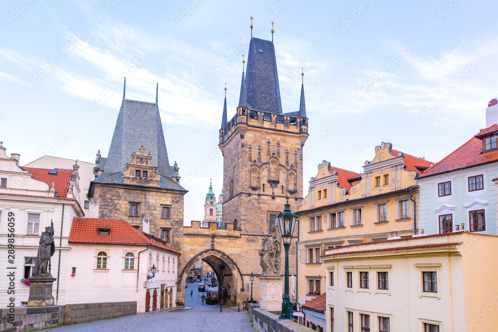 Charles bridge, old towers and statues at sunrise, Prague, Czech Republic