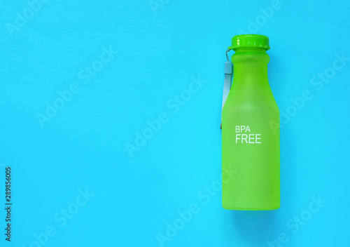 plastic reusable water bottle on a color background, zero waste concept