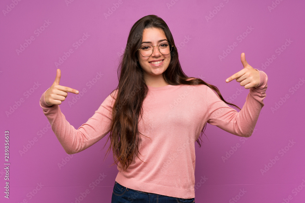 Teenager girl over purple wall proud and self-satisfied Teenager girl over purple wall proud and self-satisfied