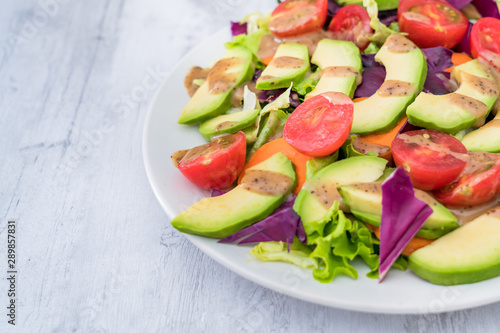 Healthy weight loss food: A plate of avocado and vegetable salad 