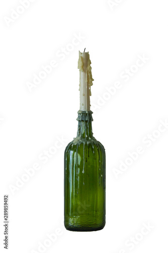 candle in the vintage green bottle isolated on white