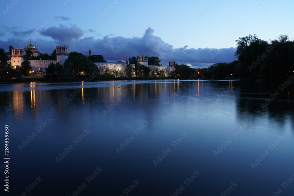 Fototapeta premium reflection of buildings in water Moscow novodevichy monastery