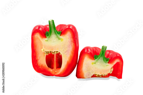 Half cut fresh red sweet ripe bell pepper isolated on white background with clipping path.