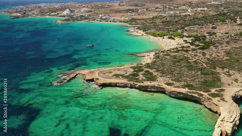 Aerial drone video of paradise rocky seascape forming caves with turquoise clear sea near popular beaches of Pori and Italida, Koufonisi island, Cyclades, Greece Aerial drone video of paradise rocky seascape forming caves with turquoise clear sea near popular beaches of Pori and Italida, Koufonisi island, Cyclades, Greece