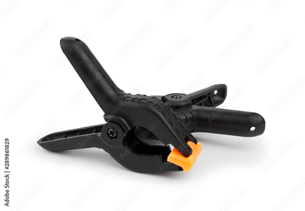 Spring clamp isolated on white background. Black plastic clamp. Set of small and big size. Clamping equipment for handicraft, joinery, photography, cars. Spring clamp isolated on white background. Black plastic clamp. Set of small and big size. Clamping equipment for handicraft, joinery, photography, cars.