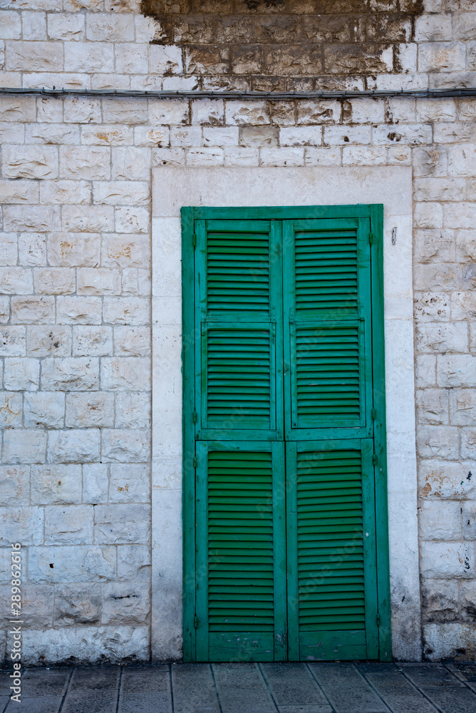 old wooden door in the wall