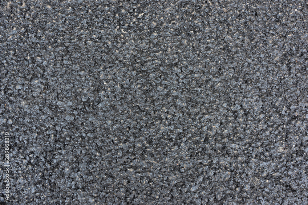 Brand new black asphalt pavement texture background Brand new black asphalt pavement texture background