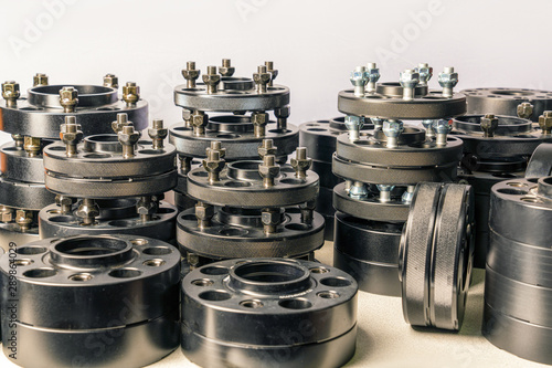 Tableau sur toile Lots of black wheel spacers for car hubs and wheels