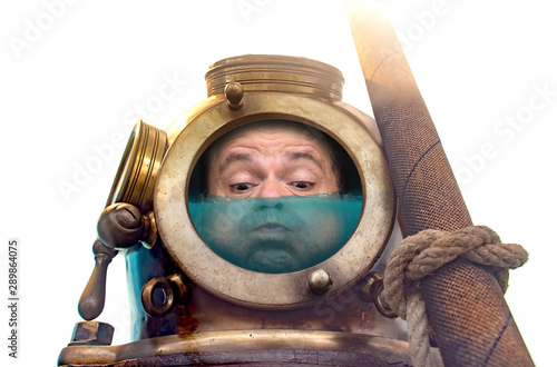 The portrait of man in old diving suit and helmet, isolated on white background. Funny diver in retro equipment with water inside his helmet..