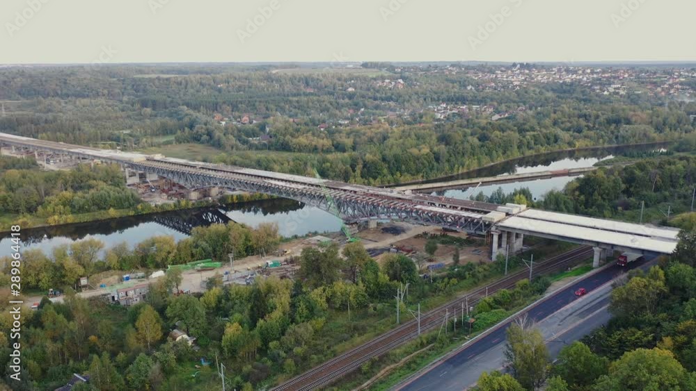 Aerial view of the construction of the highway , consisting of bridges, overpasses crossing canals, swamps, railway and road tracks Aerial view of the construction of the highway , consisting of bridges, overpasses crossing canals, swamps, railway and road tracks