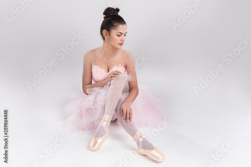 Beautiful young woman ballerina show ballet dance,dress in fink feather,professional outfit,Beauty of classic ballet.