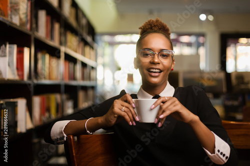 Black african american young yoman drinking coffee photo