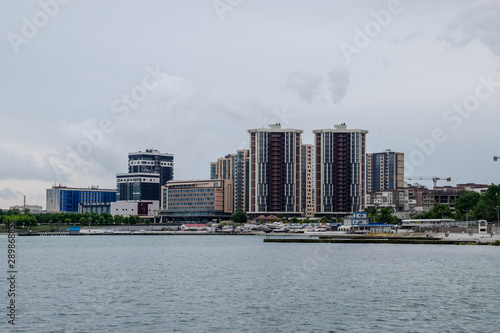 Residential multi storey buildings on the seashore. City Novorossiysk embankment of Admiral Serebryakov. photo