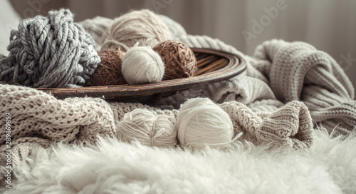 Still life with a cozy variety of yarn for knitting.