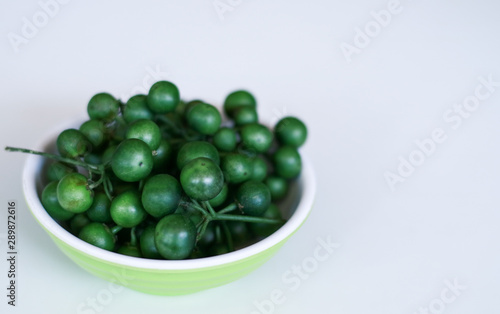 Foto Leunca or Solanum nigrum on white background.