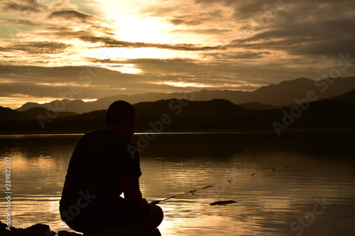 silhouette of woman on the beach at sunset